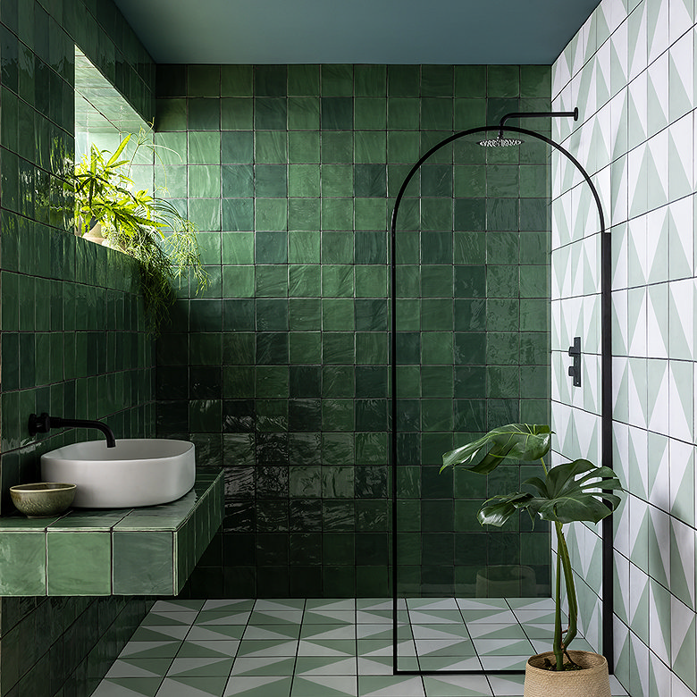green wall and floor tiles in modern bathroom