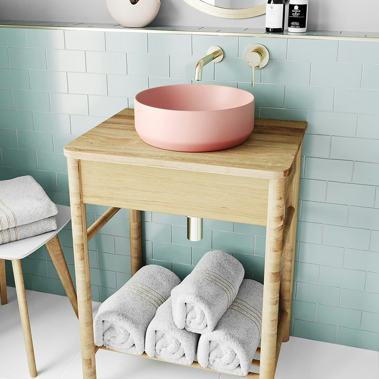 round blush pink countertop basin in pastel bathroom