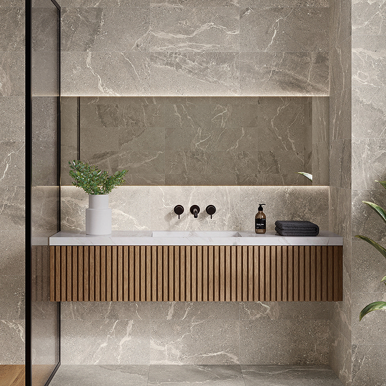 Large-format grey marble-effect bathroom tiles used across the walls and floor for a seamless, spa-like finish