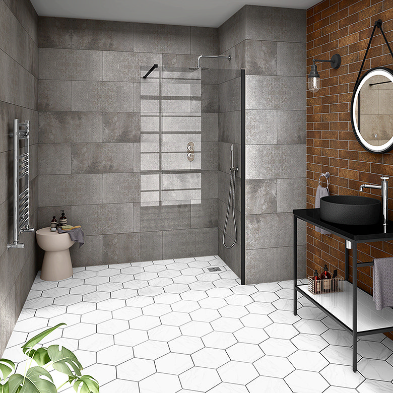 Walk-in shower bathroom combining large grey wall tiles, white hexagonal floor tiles and a rust metro tile feature wall