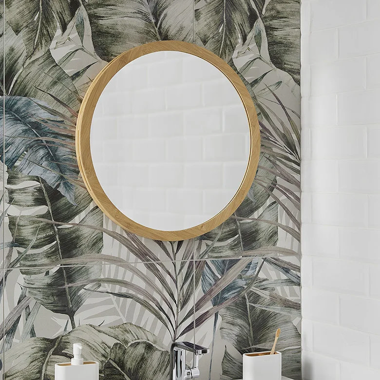 bamboo framed mirror in bright bathroom