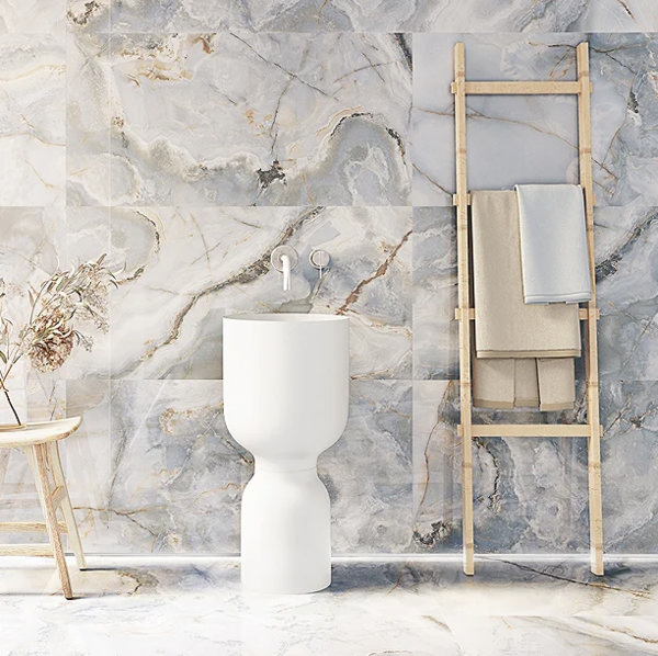 grey white marble tiles, with bathroom accessories in front of it