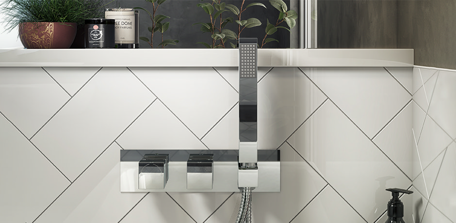 silver shower valve with white metro tiles