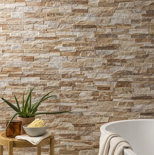 stone effect wall tiles with plant and bath
