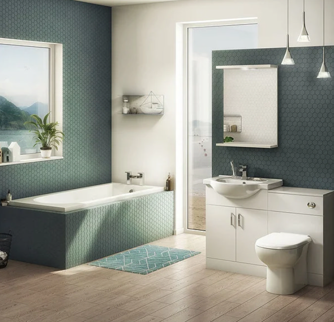 bathroom with green tiles and wooden laminate flooring and toilet suite