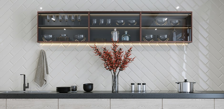 white tiled kitchen with black countertop and shelving unit