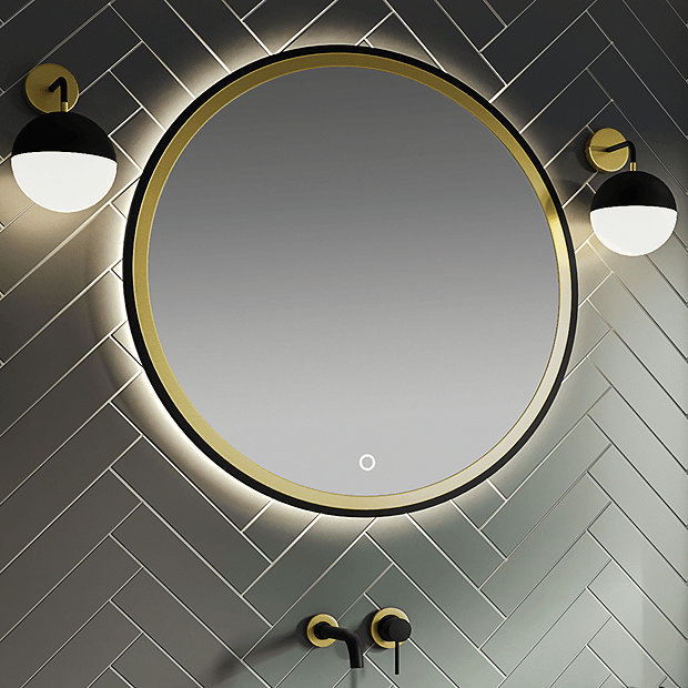 Black and brass round wall mount illuminated mirror or black herringbone tiles