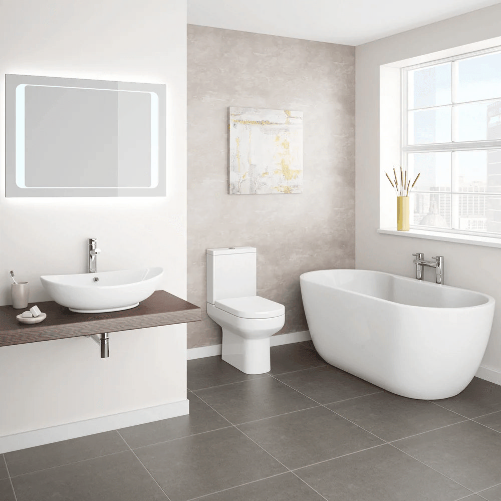 Modern white bathroom suite with grey floor