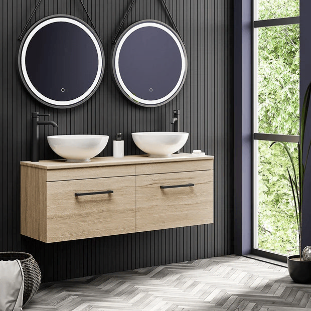 Oak wall hung doubt basin unit with counter top basis and round mirrors
