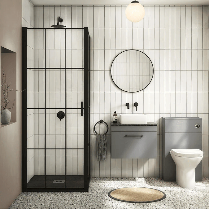 White modern tiles with black shower screen and grey furniture