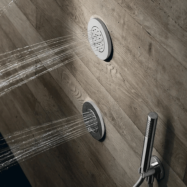 Chrome shower body jet on wood effect wall