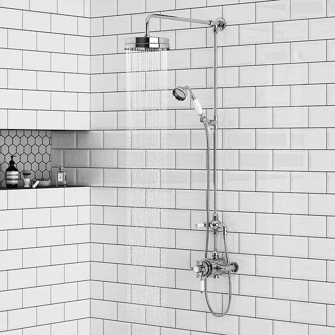 Traditional style shower on white subway tiles