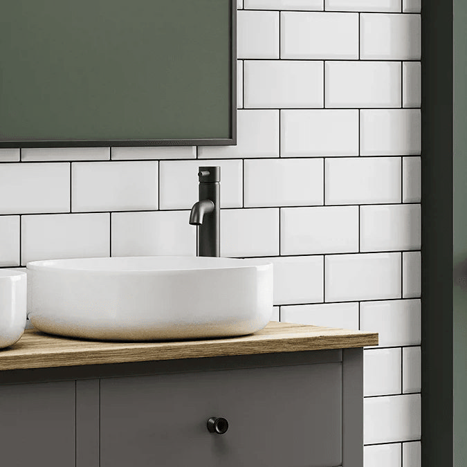 White metro tiles with basin and black tap