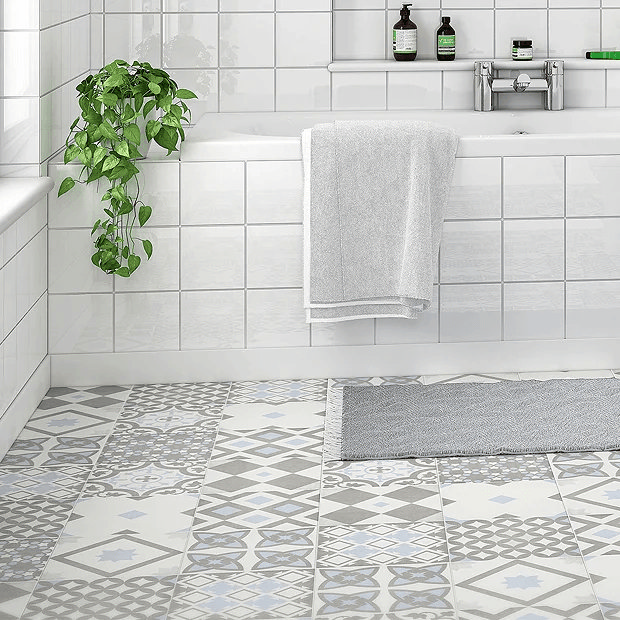 Light Blue Patterned Floor Tiles in neutral colour bathroom