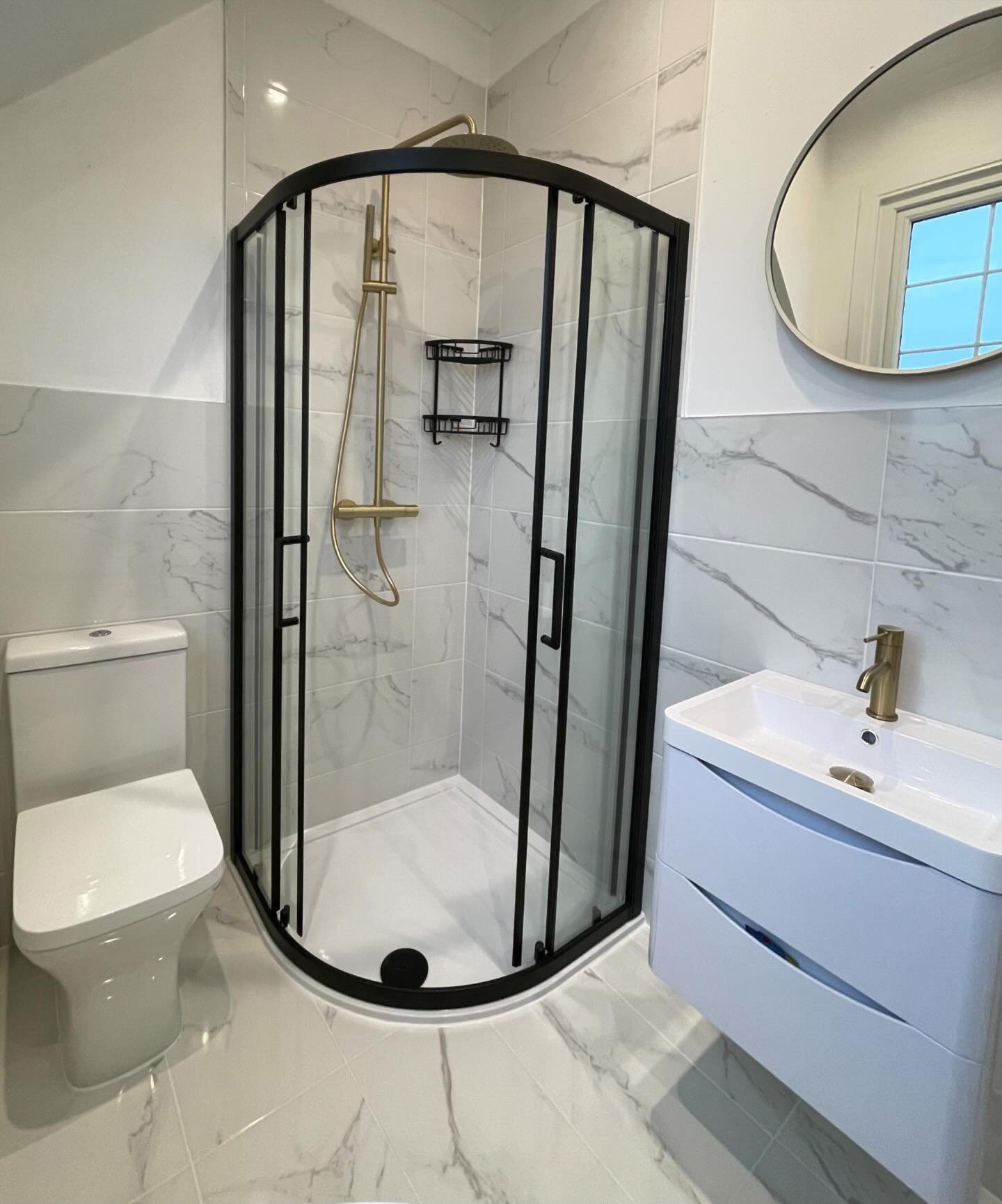 White bathroom with chrome and black accents