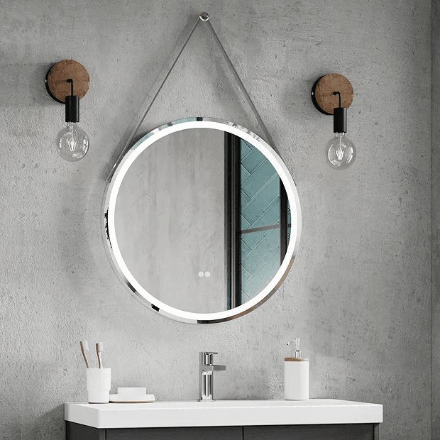 Round illuminated mirror with rustic wall lights