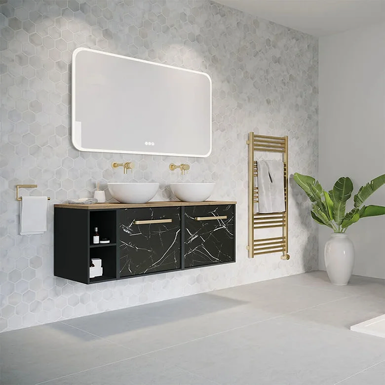 black marble vanity unit and brushed brass radiator