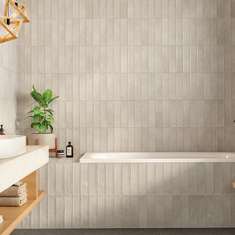 neutral rustic effect wall tiles in luxury bathroom