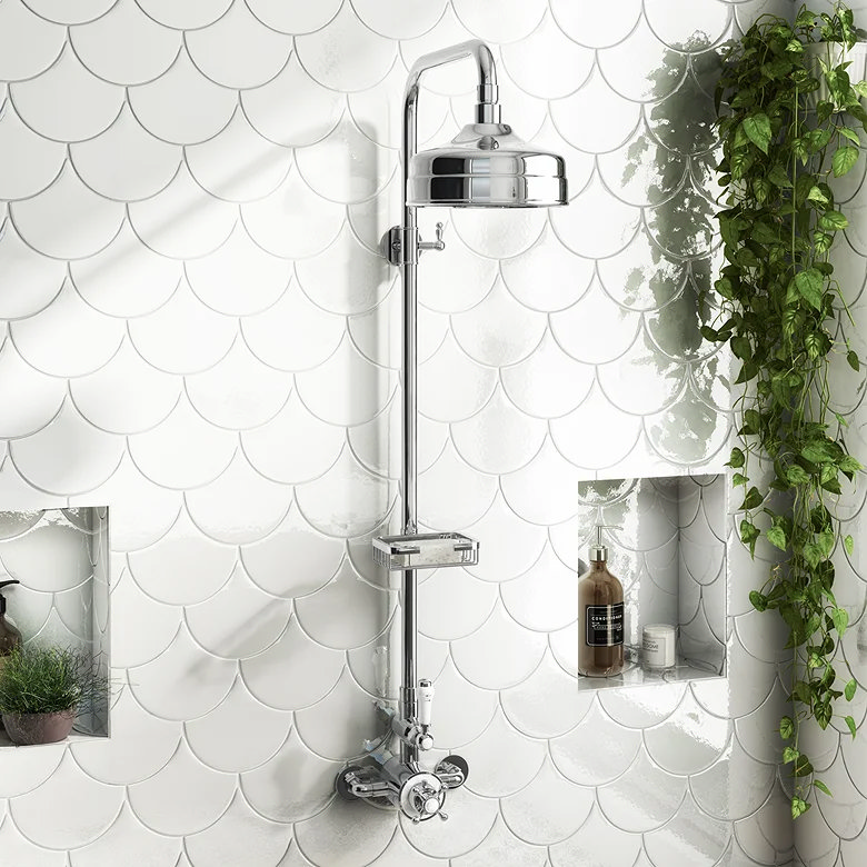 chrome traditional exposed shower with rainfall head on white fish scale tiles