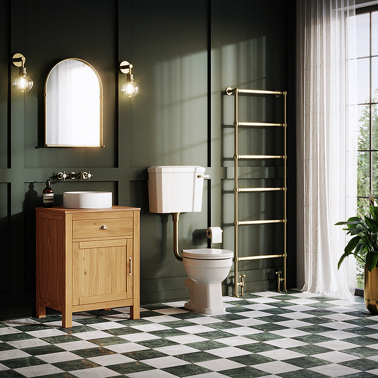 traditional bathroom with green panelled walls, oak vanity unit and checkerboard floor tiles
