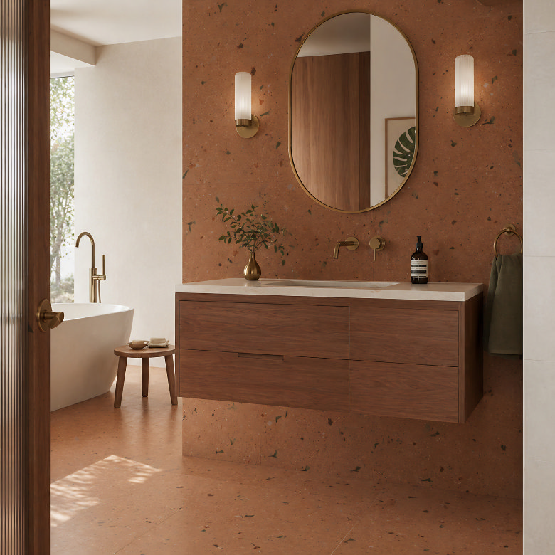 mid century modern bathroom with walnut wall hung vanity, terrazzo walls and brushed brass fittings