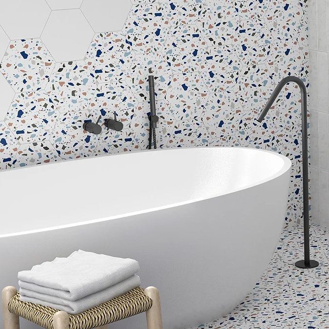 modern bathroom with freestanding bath and terrazzo hexagon wall tiles