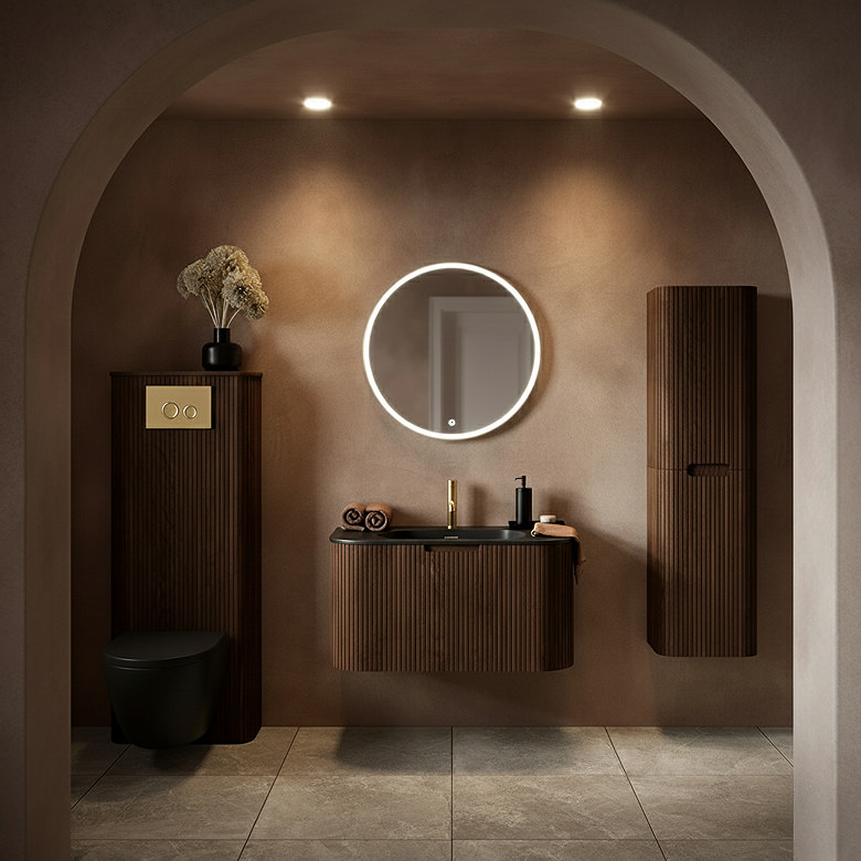 mid century modern bathroom with fluted walnut vanity, round LED mirror and wall hung storage units