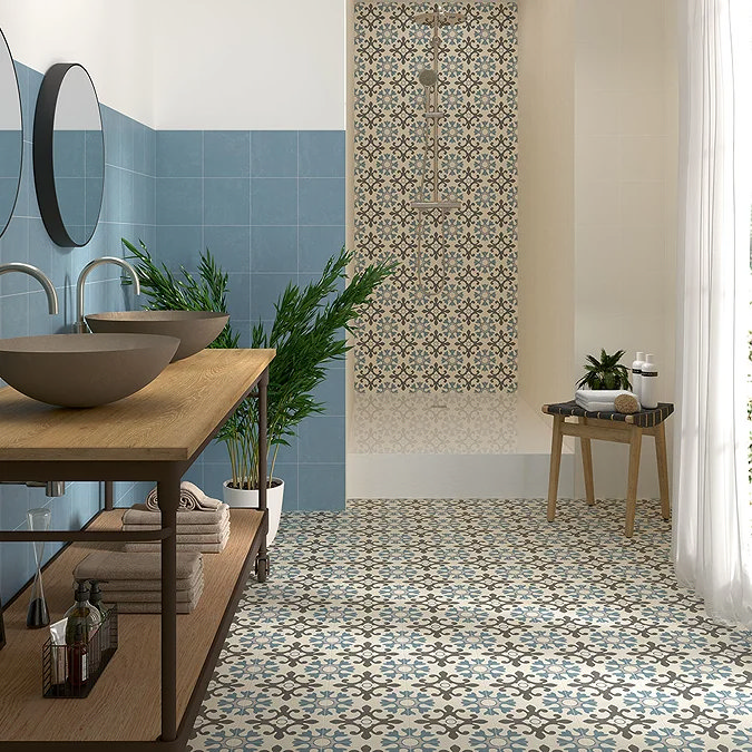bathroom with blue wall tiles, decorative floor tiles and walk-in shower enclosure