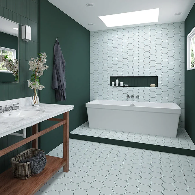 modern bathroom with green wall panels, hexagon tiles and built-in bath