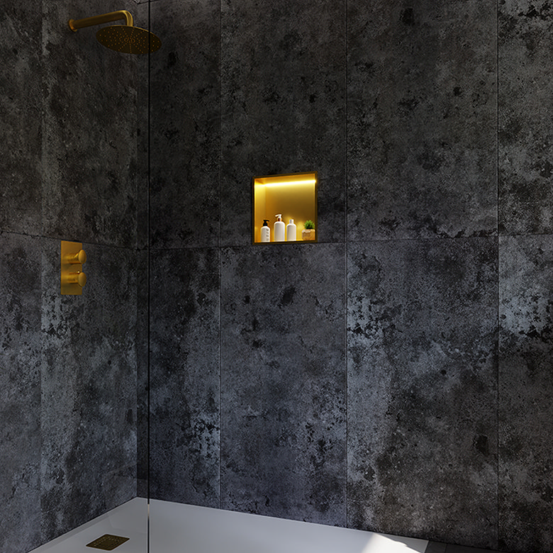 dark metal oxide effect shower wall tiles with brushed gold fittings and illuminated recessed niche
