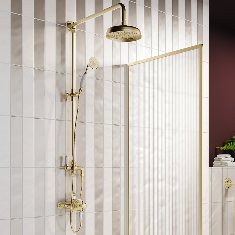 brushed brass traditional exposed shower with rainfall head on vertical beige wall tiles