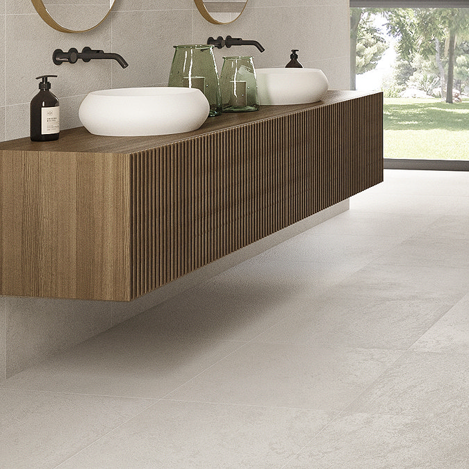 bathroom with fluted wood vanity and light grey concrete effect floor tiles