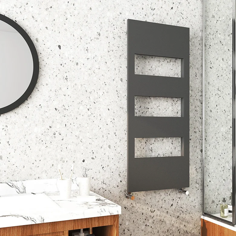anthracite cut-out towel rail on light speckled stone wall