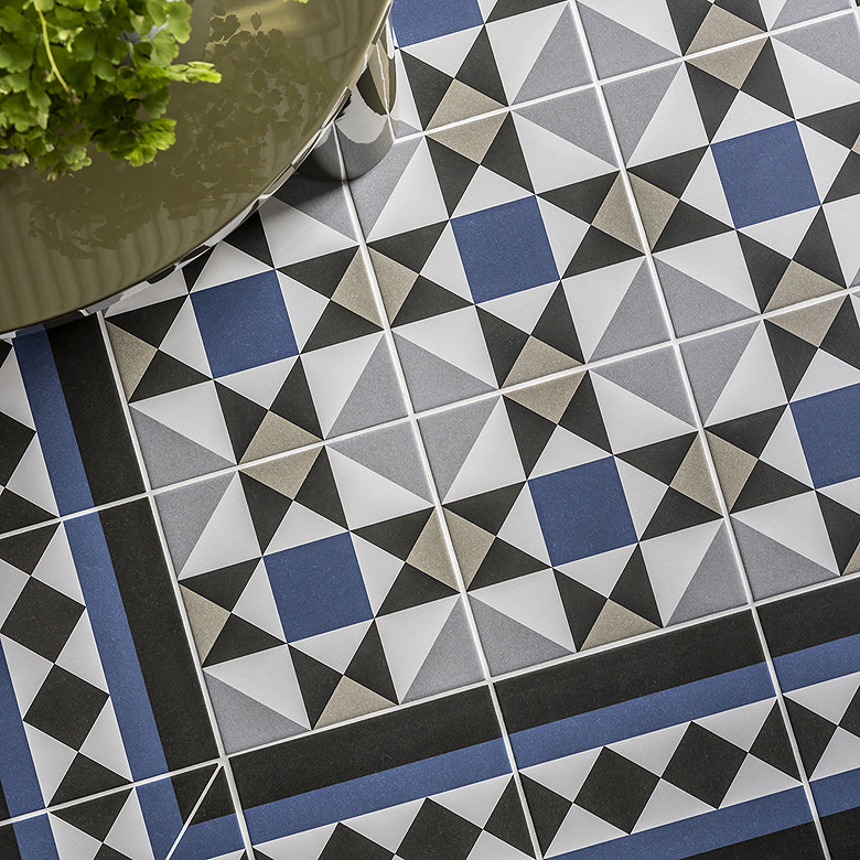 blue, grey, black patterned Victorian tiles