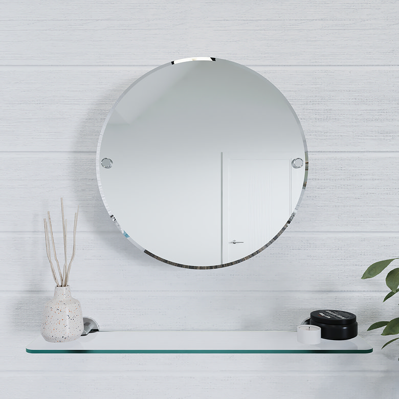round mirror above glass shelf in bathroom