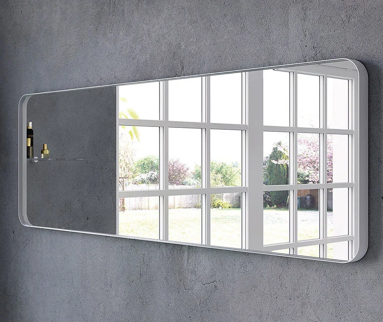 long rectangular bathroom mirror next to window