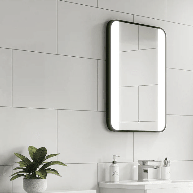 White wall tiles with black light up mirror 