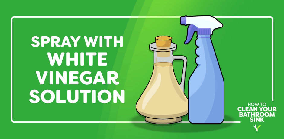 spraying the sink with white vinegar solution while cleaning the basin