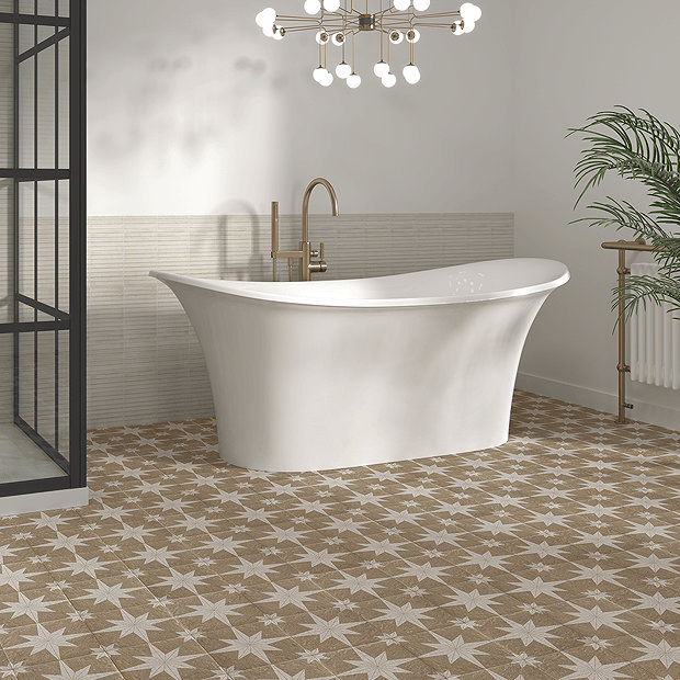 Beige and white floor tiles with freestanding bath and brass tap