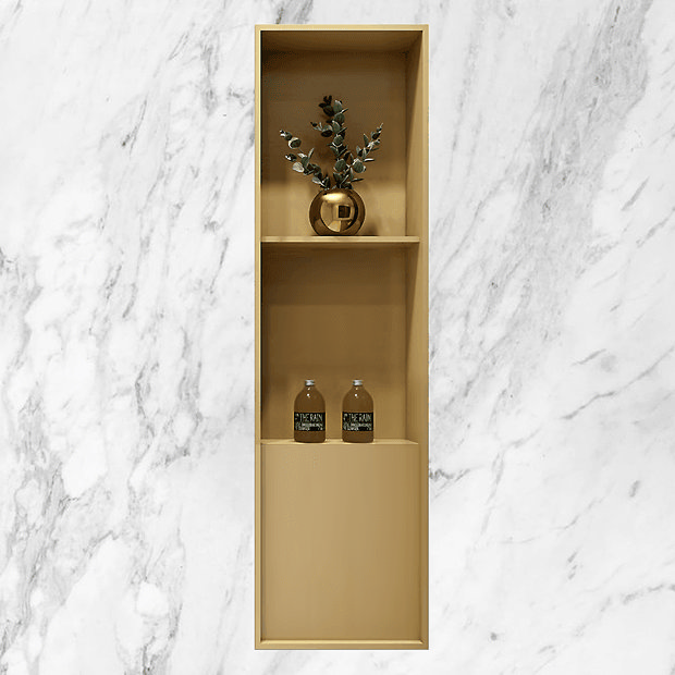 Gold shower niche against marble wall