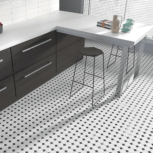 Black and white mosaic floor tiles in kitchen