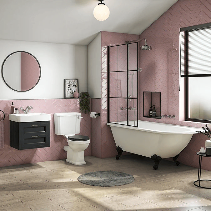 Pink tiled bathroom with black accents