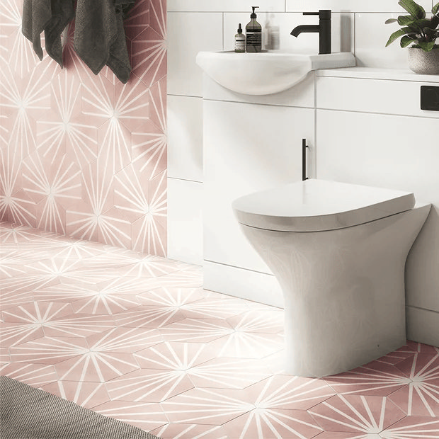 Pink and white tiles in small bathroom
