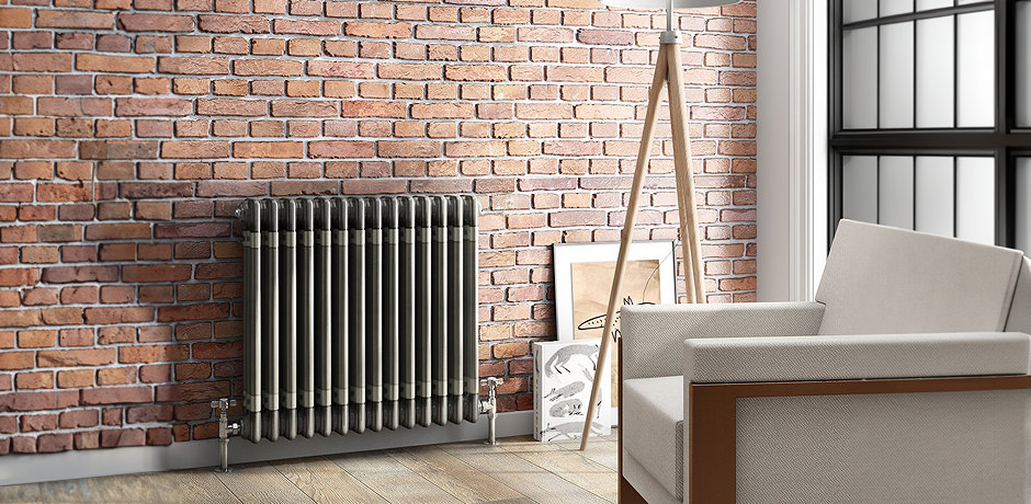 Grey radiator on black wall
