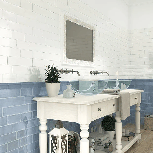 Blue brick effect wall tiles behind traditional style washstand