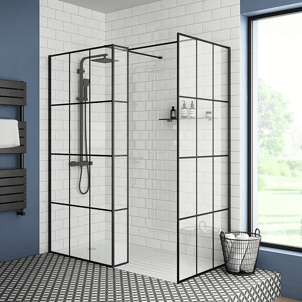 Black grid shower screen in blue bathroom with white tiles