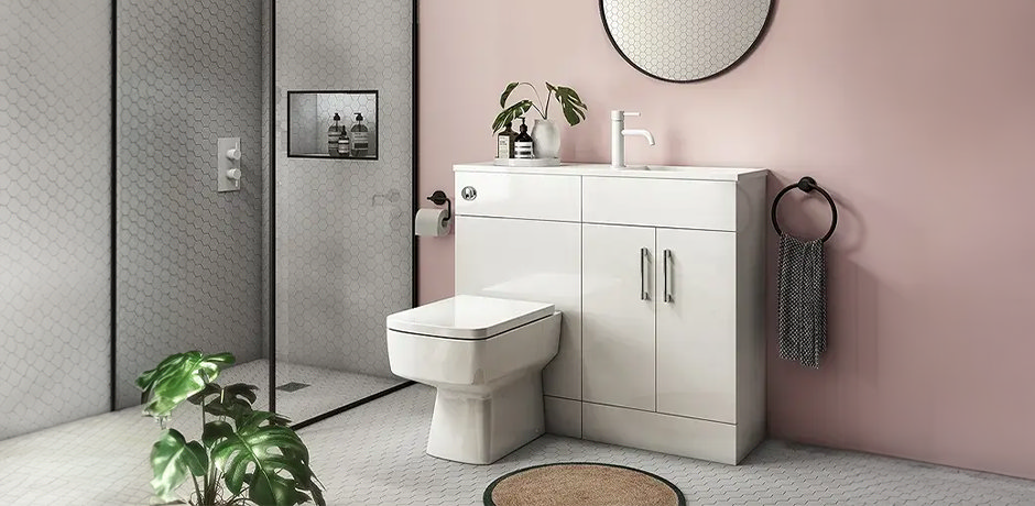 Pink bathroom with white combination unit