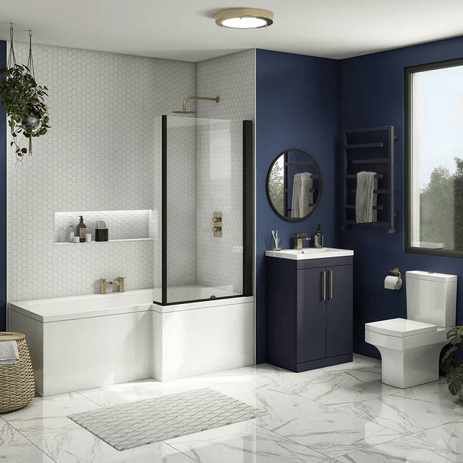 White and blue bathroom with shower bath and navy vanity unit with brass accents