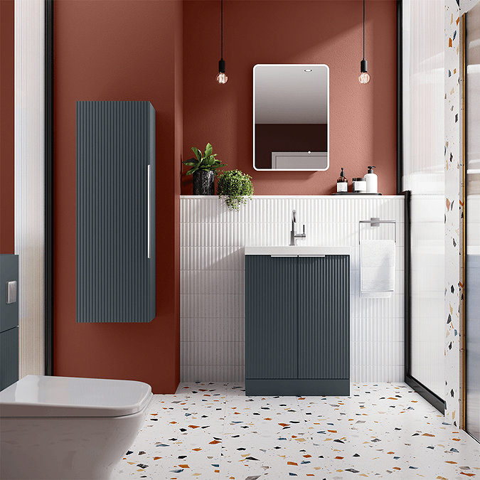 Small bathroom with grey fluted furniture and burnt orange walls