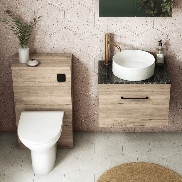 Wooden bathroom furniture with pink tiles